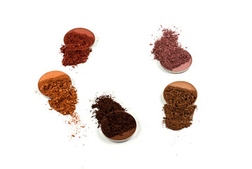 Eyeshadow crushed palette, colorful eye shadow powder isolated on a white background.