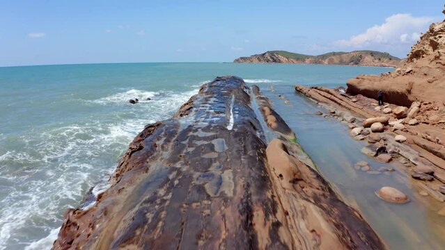 4k drone forward video (Ultra High Definition) of huge reef on Zvernec Beach. Beautiful seascape of Adriatic sea. Fantastic morning scene of Albania, Europe. Vacation concept background..