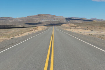Fototapeta na wymiar long road to the desert with negative space