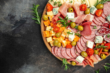 appetizers or antipasto set with gourmet food. Mixed delicatessen of cheese and meat snacks, Food recipe background. Close up
