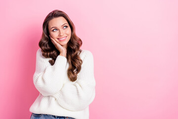 Photo of stunning positive lady hand touch cheek look empty space ad isolated on pink color...