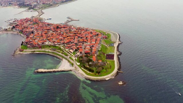 4K aerial - a bird's eye view&nbsp;video (Ultra High Definition) of old town of Nessebar. Picturesque seascape of Black sea. Aerial outdoor scene of Bulgaria, Europe. Traveling concept background.