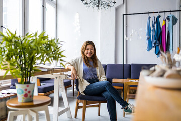 Female fashion designer in her loft studio
