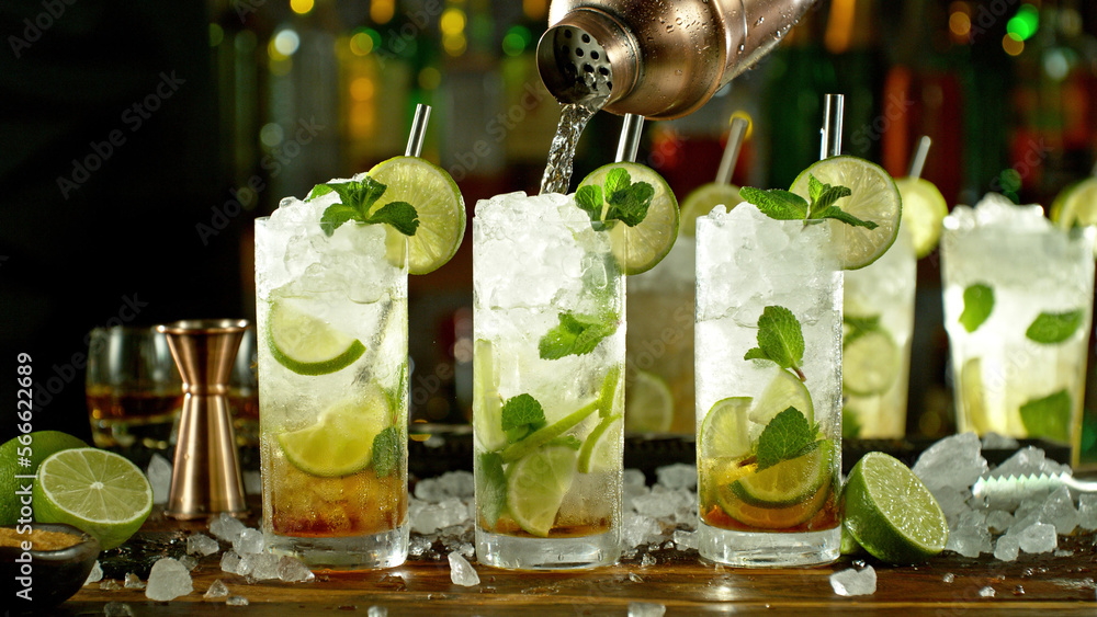 Poster preparation of mojito drinks on bar counter.