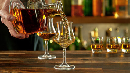Detail of pouring rum into glass.