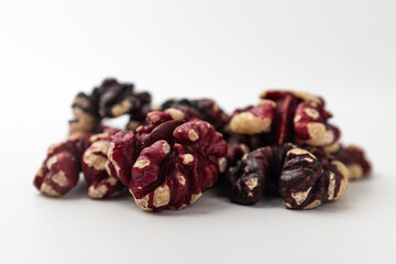 Red walnuts on a white background