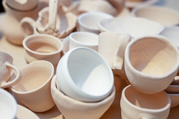 Lots of pottery pots in workshop. DIY and hobby concept.