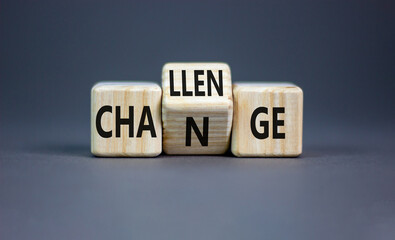 Challenge and change symbol. Concept word Challenge Change on wooden cubes. Beautiful grey table...