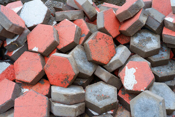 Pile of dyed red stone cubes for making outdoor pavement tiles