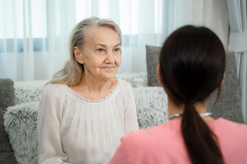 Friendly nurse supporting senior lady at nursing home,Senior services and geriatric care concept.