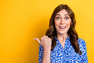 Photo of young astonished crazy positive business lady wear blue shirt direct finger empty space...