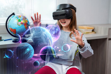 Child girl wearing virtual reality headset and looking at digital space system with planets or...