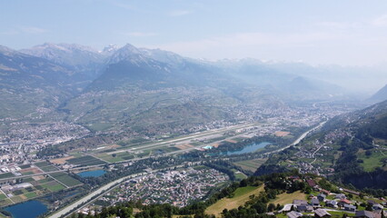 Swiss Alps in Sion region, aerial footage taken by a drone during warm summer time, clear blue skies and beautiful mountain scenery