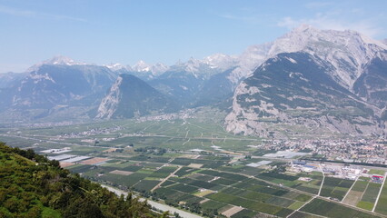 Swiss Alps in Sion region, aerial footage taken by a drone during warm summer time, clear blue skies and beautiful mountain scenery