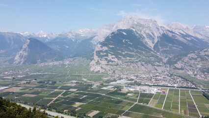 Swiss Alps in Sion region, aerial footage taken by a drone during warm summer time, clear blue skies and beautiful mountain scenery