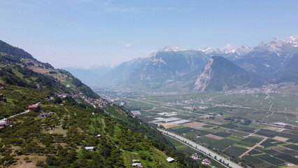 Swiss Alps in Sion region, aerial footage taken by a drone during warm summer time, clear blue...