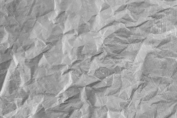 Gray painted paper, crumpled and torn, soft focus