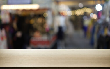 Empty wooden table in front of abstract blurred background of coffee shop . can be used for display or montage your products.Mock up for display of product