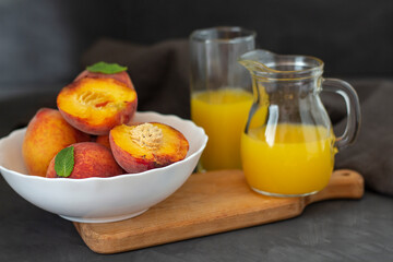 Fresh peach juice. Peaches and peach juice. Fresh and healthy juice in a glass and decanter. copy...