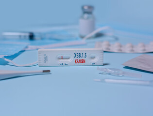 Express Covid-19 XBB.1.5 Kraken Variant strain test,Schnelltest, medical mask, syringe,thermometer,medicine on a blue background.Diagnosis of virus, Inhibition of disease outbreaks.Copy space