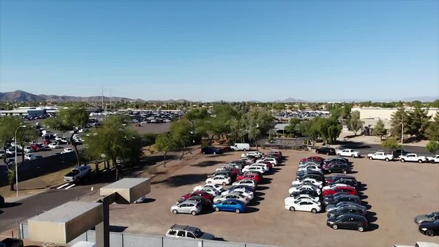 Cars at the Copart junkyard. Aerial view, drone flying over damaged cars in the dealer's parking lot. Selling and sending cars
