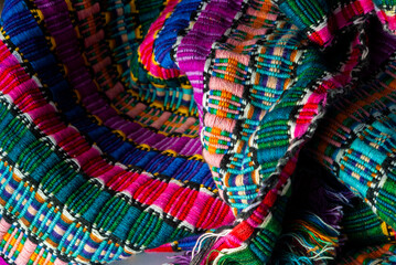 Handmade textile detail made by Guatemalan artisan in Central America, colorful detail full of tradition and culture, colonial history, Mayan cosmovision. 