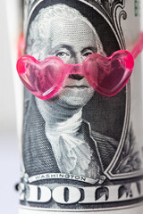George Washington from US 1 dollar banknote in pink heart sunglasses