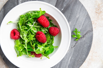 raspberry salad green leaves mix salad healthy meal food snack on the table copy space food background rustic top view keto or paleo diet veggie vegan or vegetarian food