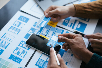 ux Graphic designer team planning application process development prototype wireframe for web mobile phone . User experience concept..