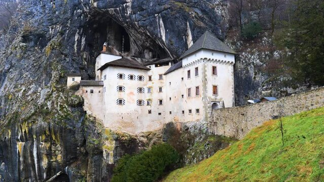 View of the Predjama Castle in Slovenia. Places of historic interest. The impregnable medieval marvel has been perched in the middle of a 123 meter high cliff for more than 800 years. 