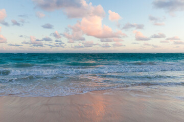 Fototapeta premium Coastal landscape with an empty sandy beach and shore waves