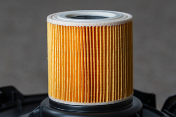 Cartridge filter for vacuum cleaner, closeup. Filter for air purification for a healthy lifestyle...