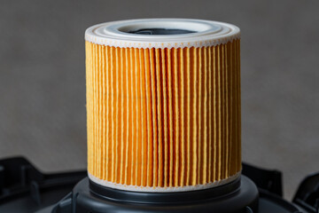 Cartridge filter for vacuum cleaner, closeup. Filter for air purification for a healthy lifestyle housekeeping