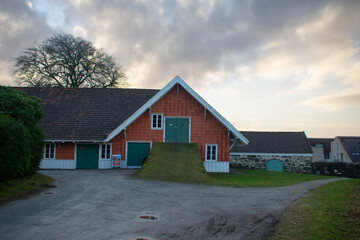 Fototapeta na wymiar Classic Red Barn At Sunset