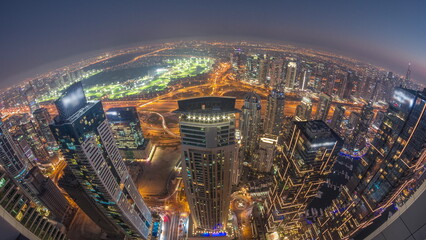 Panorama of Dubai Marina with JLT skyscrapers and golf course day to night , Dubai, United Arab Emirates.