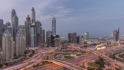Naklejka na ściany i meble Dubai Marina highway intersection spaghetti junction day to night