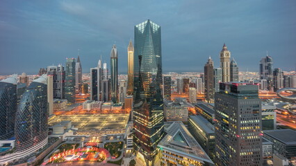 Fototapeta na wymiar Panorama of futuristic skyscrapers in financial district business center in Dubai night to day