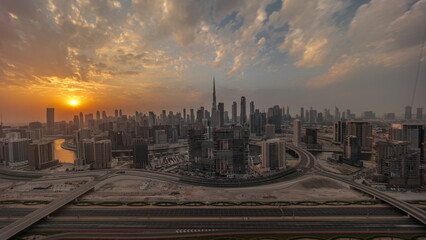 Sunset over panoramic skyline of Dubai with business bay and downtown district .