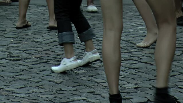 Legs of Women Dancing on the Street in San Telmo District, Buenos Aires, Argentina. Low Angle View. 