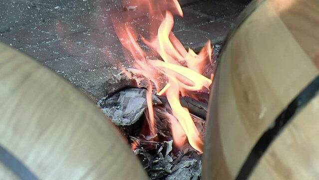 Preparing Drums by Heating the Skins by a Fire, Drummers Tune their Drums by the Heat of Fire on a Street in Buenos Aires, Argentina. Close Up.