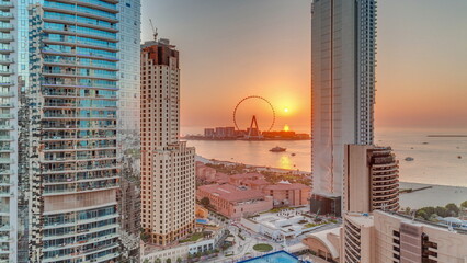 Panoramic sunset view of the Dubai Marina and JBR area and the famous Ferris Wheel aerial