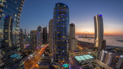 Panorama of the Dubai Marina and JBR area and the famous Ferris Wheel aerial day to night