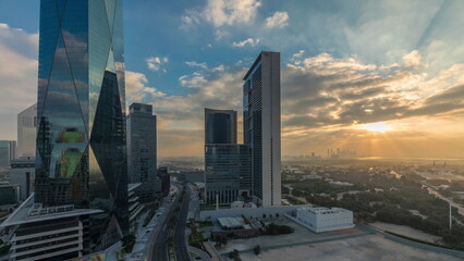 Fototapeta na wymiar Dubai International Financial district aerial night to day . Panoramic view of business office towers.