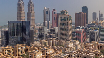 Skyscrapers in Barsha Heights district and low rise buildings in Greens district aerial all day . Dubai skyline