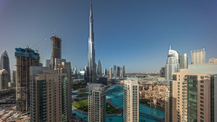 Panorama showing Dubai Downtown cityscape with tallest skyscrapers around aerial .
