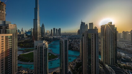 Dubai Downtown cityscape during sunrise with tallest skyscrapers around aerial
