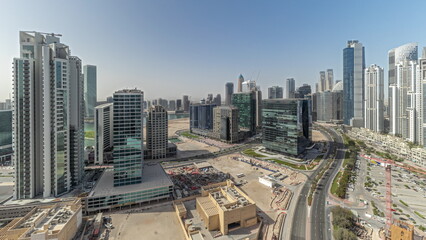 Naklejka na ściany i meble Panorama showing Bay Avenue with modern towers residential development in Business Bay aerial , Dubai