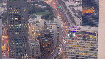 Office skyscrapers in financial district aerial day to night