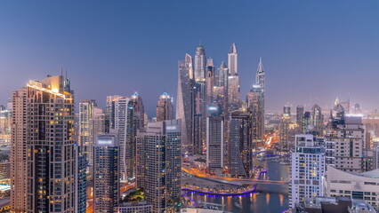 Fototapeta na wymiar View of various skyscrapers in tallest recidential block in Dubai Marina aerial day to night