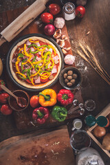 Top view images, pizza ready to bake, equipment and ingredients, vegetables for making pizza. to food homemade concept.